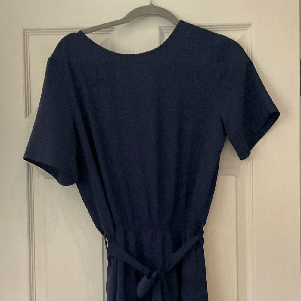 Navy blue romper and never worn.